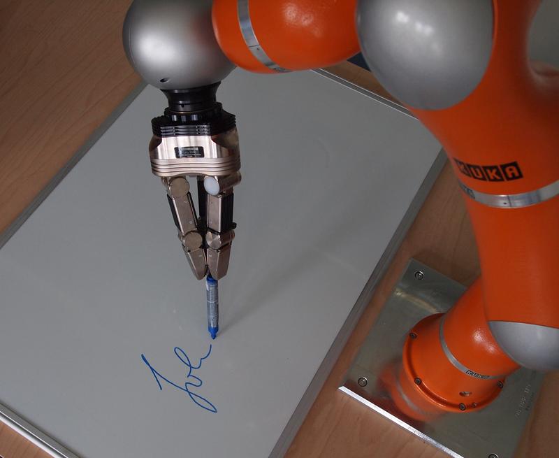 The robotic arm perfectly mimics a sample of handwriting.