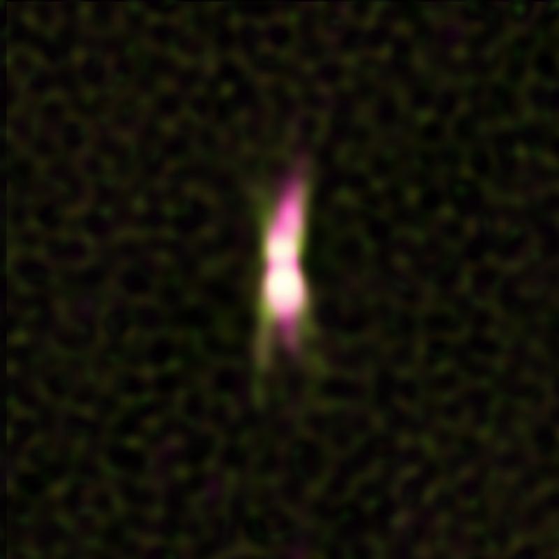 Ein Jet energiereicher Teilchen (im Bild Magenta) gestaltet die Umgebung des Sterns IRAS 15445-5449. Der Stern wird durch den Staub um ihn herum verdeckt.