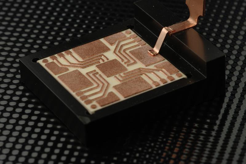Laser-welded copper ribbon bond. 