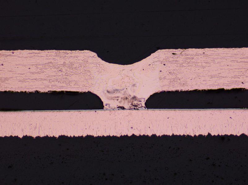 Cross-section of a LIMBO joint between a 200 µm copper interconnector and a printed circuit board.