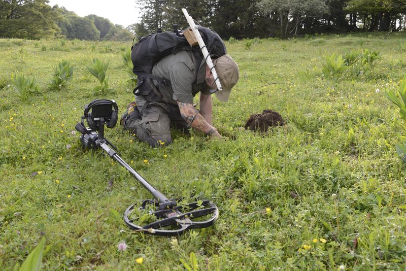 Meteorite hunter in the huge meteorite strewn field near Twann in the Canton of Bern (Switzerland) 