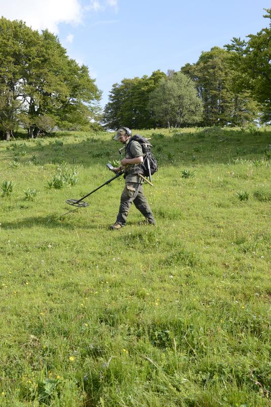 Meteorite hunter in the huge meteorite strewn field near Twann in the Canton of Bern (Switzerland) 
