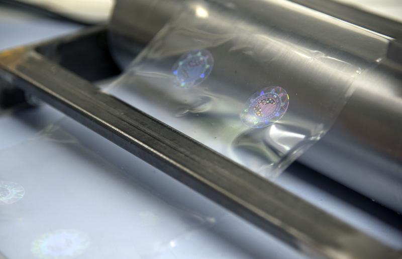 Nanostructure elements on a foil that shall be produced in a roll-to-roll-printing process, here in a laboratory scale.