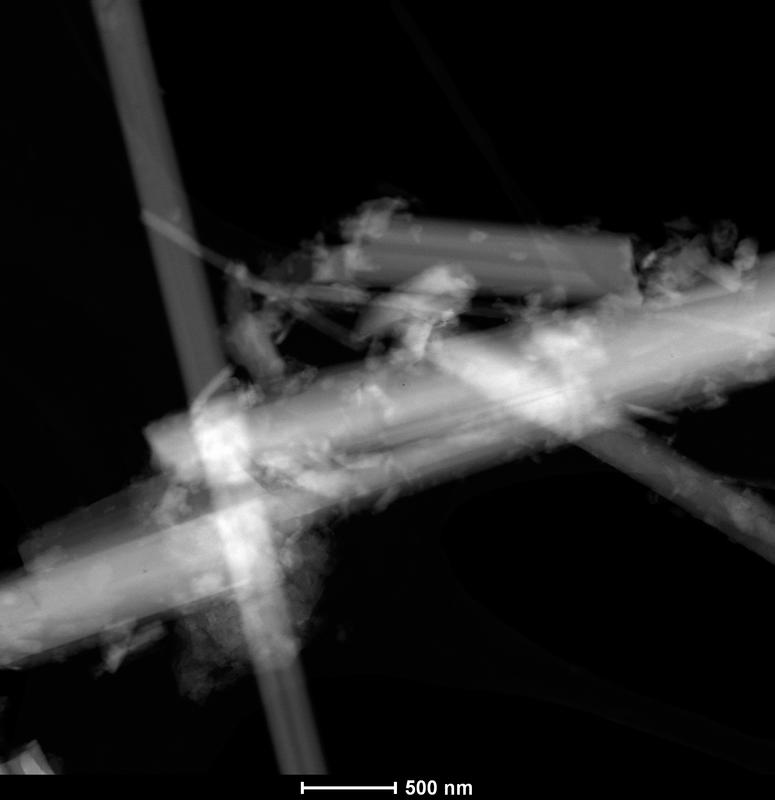 Fibers of the mineral erionite with adhering particles, taken by a transmission electron microscope at the Institute of Geosciences of the University Jena.