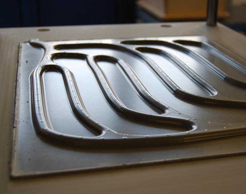 TABSOLAR component made of Ultra-High Performance Concrete (UHPC), manufactured via the membrane vacuum deep-drawing process