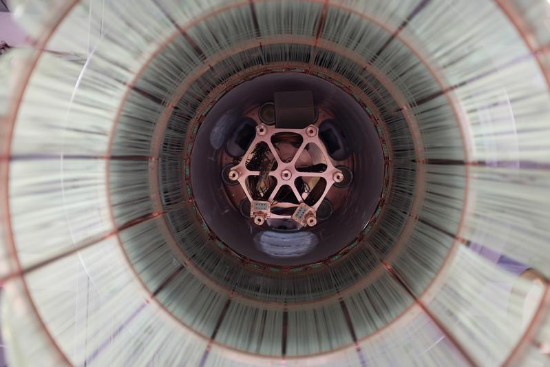 View from bottom into the GERDA experiment: The fiber shroud of the liquid argon veto and the copper head for mounting the germanium strings.