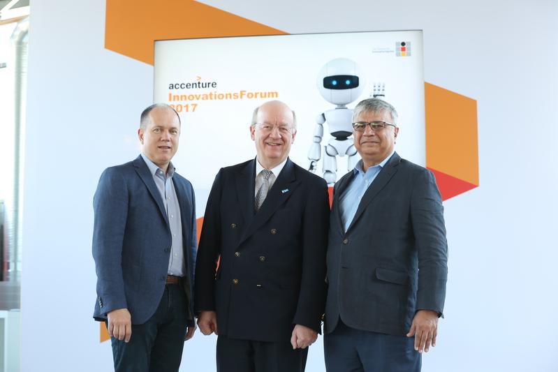 Frank Riemensperger (Country Managing Director for Germany at Accenture), Prof. Dr. Wolfgang Wahlster (CEO DFKI), Narendra Mulani (Chief Analytics Officer Accenture) celebrate the cooperation.
