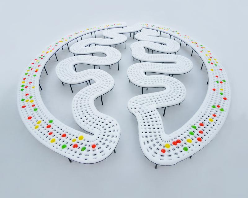 MADM im Schneegehirn: Schneeflocken, die die Bank bedecken, symbolisieren die unzähligen nicht gekennzeichneten Zellen, die bunten Ballone zeigen das dünn gesäte Mosaik aus Neuronen und Gliazellen.