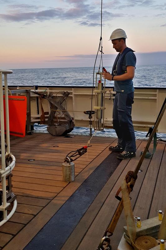 Onboard R/V Heincke, Knut Krämer prepares a sound velocity probe for surveying the sea floor with the multibeam echosounder.