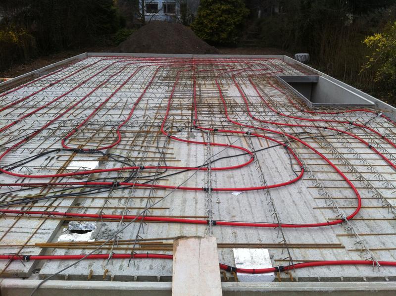 Installation of the thermal activation into the ceiling between cellar and ground floor in the prototype building.