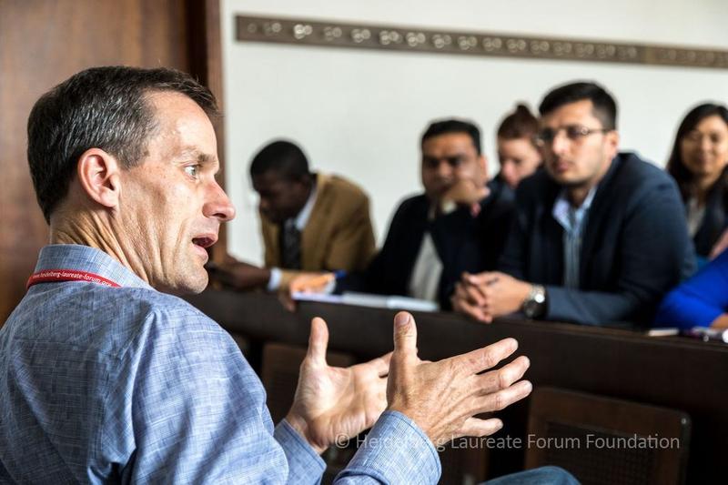 ACM Prize in Computing recipient Jeff Dean discusses with young researchers at the 5th HLF this past September.