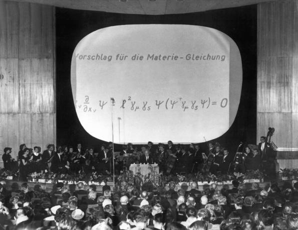 Werner Heisenberg presenting his "Weltformel" at the 1958 Planck Centenary in West Berlin.