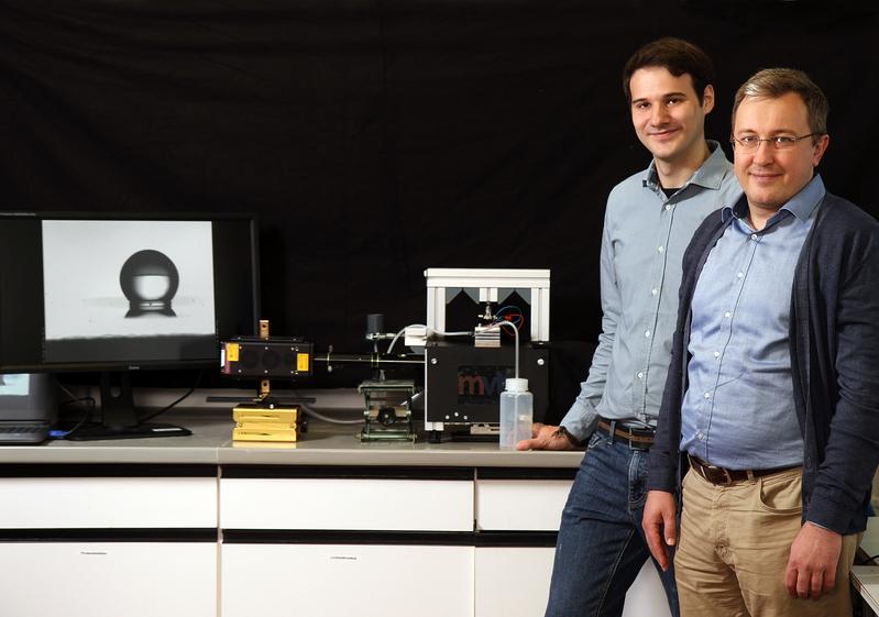 Fabian Krull (left) and Professor Sergiy Antonyuk ) are investigating what happens when drops hit difference surfaces.