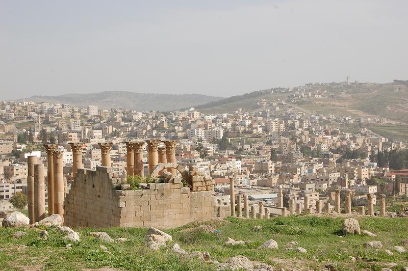 Archaeological monuments before present-day building activity: photograph of the city and the excavation site of ancient Jerash in Jordan.