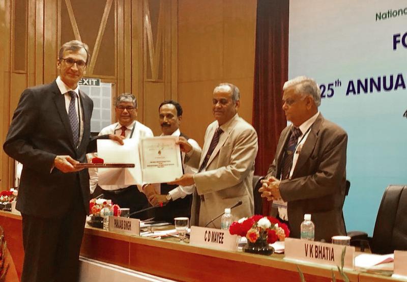 Prof. Singh (2  RHS) presented the membership certificate to Prof. Graner (left).