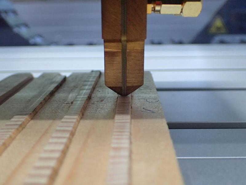 High-frequency probe of the LIGNOSTATION when scanning a wood sample.