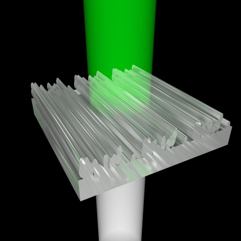 Licht trifft von unten auf die 3D-gedruckten Nanostrukturen. Verlässt es die Strukturen wieder, sieht der Betrachter nur noch grünes Licht - die restlichen Farben werden abgelenkt. 