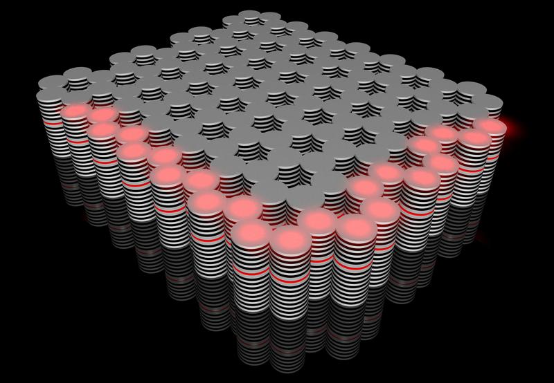 The novel topological insulator built in the Würzburg Institute of Physics: a controllable flow of hybrid optoelectronic particles (red) travels along its edges.