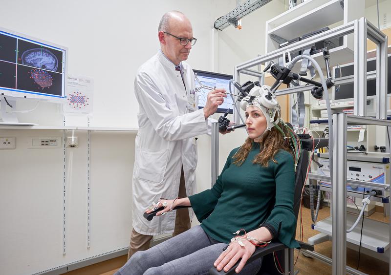 The precursor to the helmet: Only two coils are used to deliver stimuli, and not every part of the cerebral cortex can be reached.