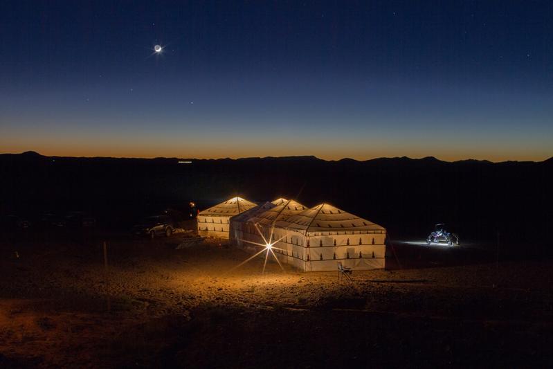 The camp in the desert at night.