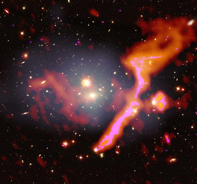 Galaxy cluster Abell 1314 with radio emission from high-speed cosmic electrons (marked in red) overlayed onto an optical image also showing hot X-ray gas (marked in grey).