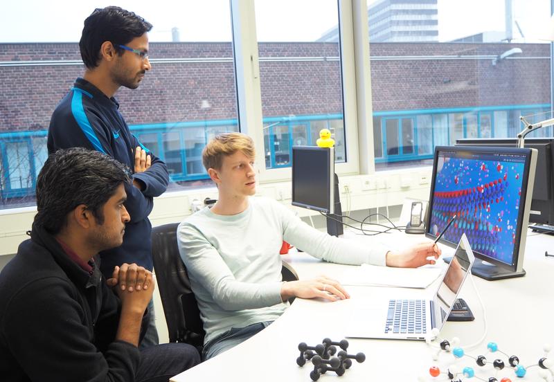 Dr. Ashton (on the right) explaining his work about etching reactions for MAX compositions to his colleagues in the Computational Materials Design department.