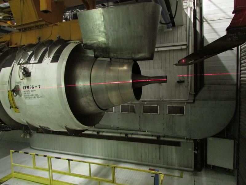 Close-up of the turbine engine at the testing facility with the aerosol sampling probe in place (right).