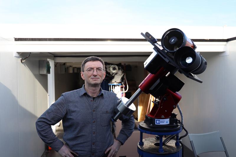Professor Hakan Kayal next to the moon telescope. 