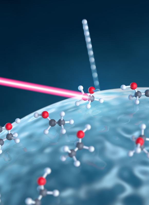 Ein intensiver Laserpuls (rot) trifft auf ein Nanoteilchen aus Glas und interagiert dabei mit Molekülen an dessen Oberfläche. Daraufhin werden Wasserstoffionen herausgelöst.