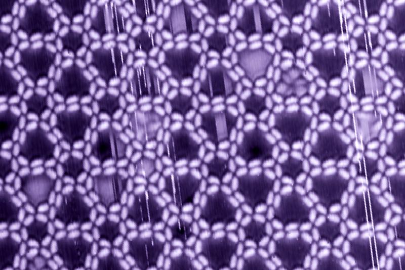 Complex supramolecular nano-structure on a silver surface. The chiral pattern is controlled by hydrogen-bonding between hydroxamic acids decorating both ends of the rod-like building block. 