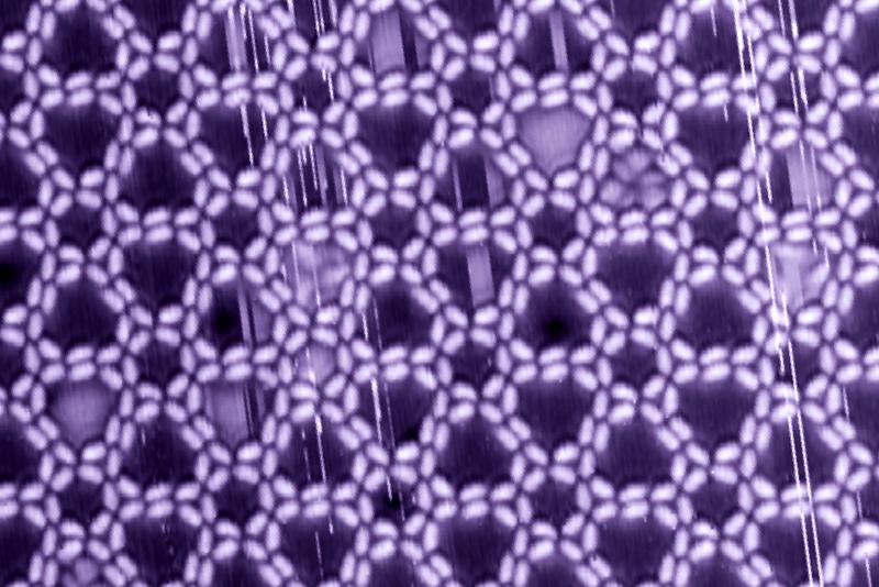 Complex supramolecular nano-structure on a silver surface. The chiral pattern is controlled by hydrogen-bonding between hydroxamic acids decorating both ends of the rod-like building block. 