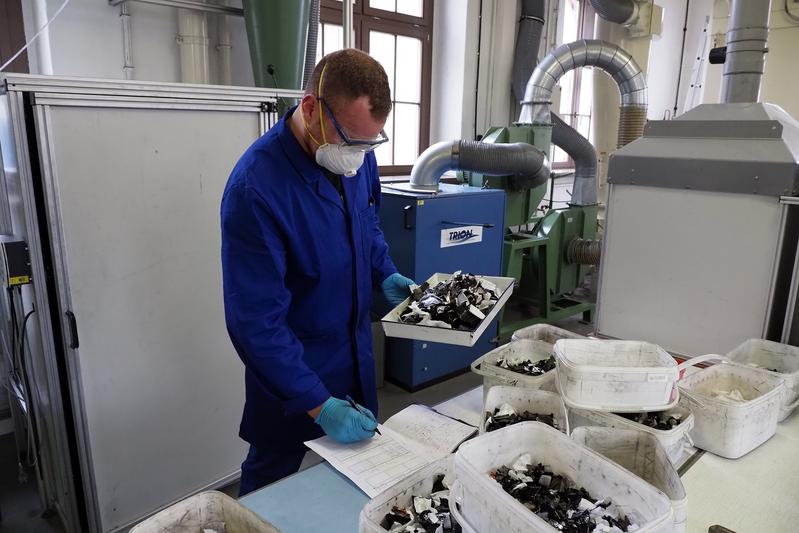 Student Paul Reitemeyer sorting the shredded material.