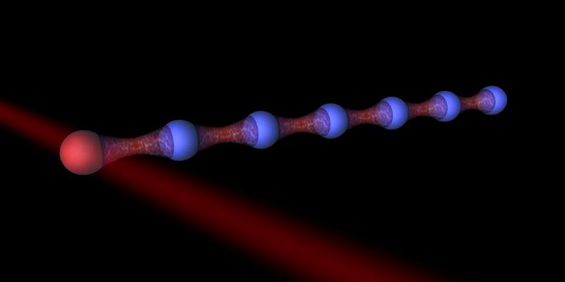 Darstellung eines Ionenfallen-Quantensimulators samt Hilfsteilchen (rot)