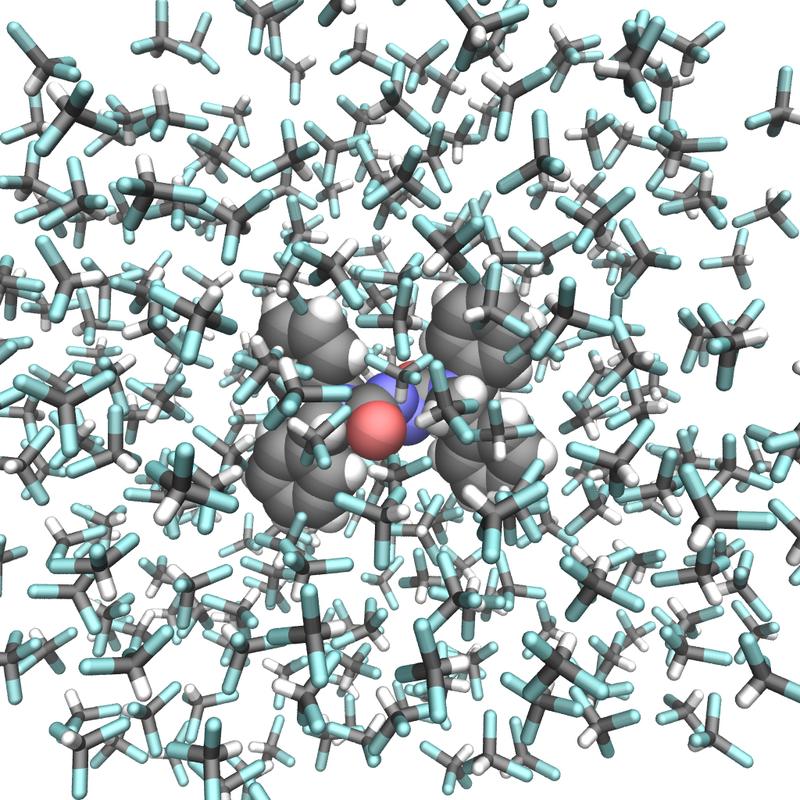 Molecular structure of the photo-responsive molecular switch (center) surrounded by solvent molecules. The scientists revealed a light-induced pedalo-type motion. The image is on the cover of the recent print edition of the journal.