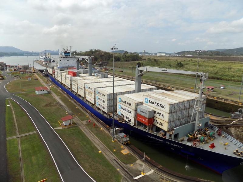 Container ship crossing the Panama Canal at Miraflores locks.