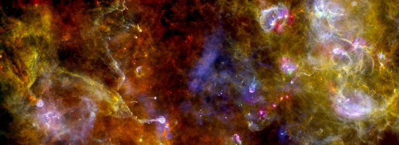  Clouds of interstellar dust and gas, here in the region "Cygnus-X" in the Swan constellation. Image: ESA/PACS/SPIRE/Martin Hennemann & Frédérique Motte, Laboratoire AIM Paris-Saclay, CEA/Irfu – CNRS/INSU – Univ. Paris Diderot, France.