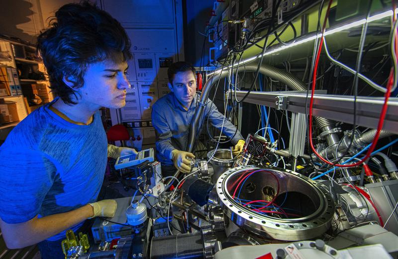 Alexey Grinin and Dery Taray working on the vacuum system of teh 1S-3S experiment.