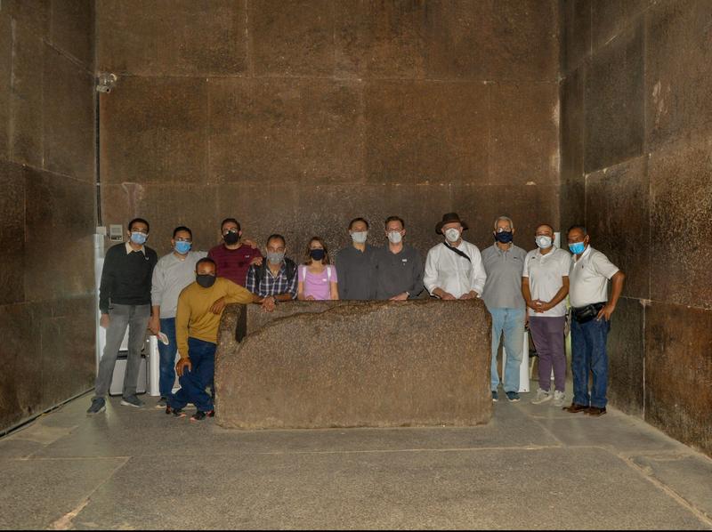 The Egyptian-German measuring team in the King's Chamber of the Pyramid of Khufu with the sarcophagus of Khufu. 