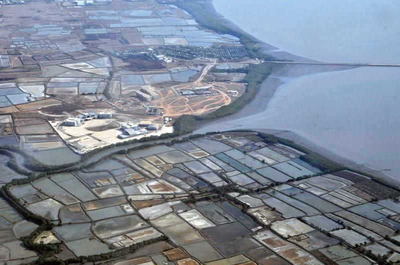 In many countries of Southeast Asia, aquaculture ponds are lined up along the coasts for many miles, as here on Sulawesi, Indonesia. 