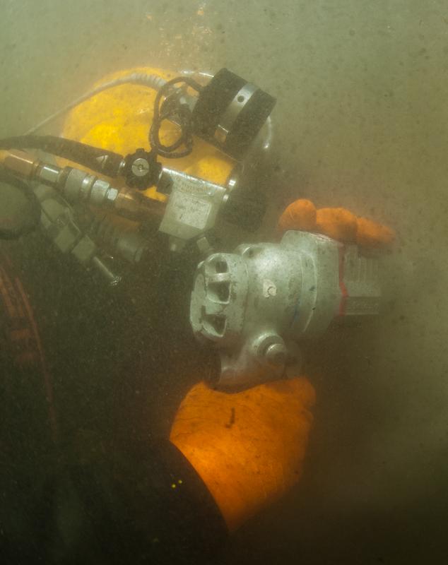 Diver working in murky water