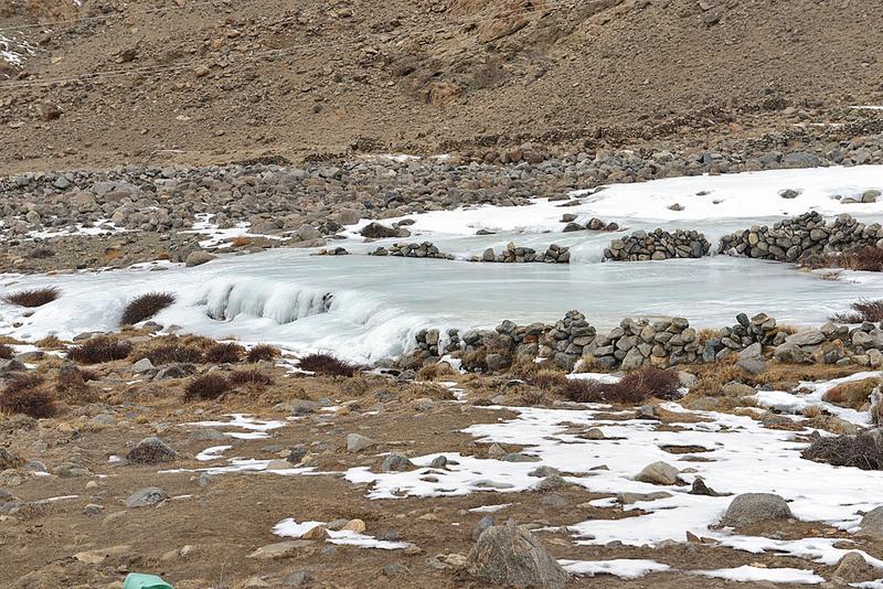 Aufeis formation in the area of a flat valley section below a springshed at 4,400 meters