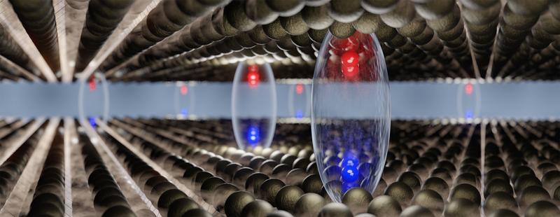 Interlayer excitons (glossy ellipsoids), which can form after electrons and holes (red and blue spheres) are separated between optically excited, atomically thin layers (top and bottom sheet).