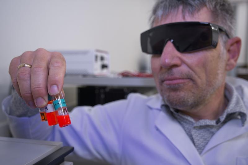 Energy vibration: Jakob Heier with samples of his "antenna dye." 