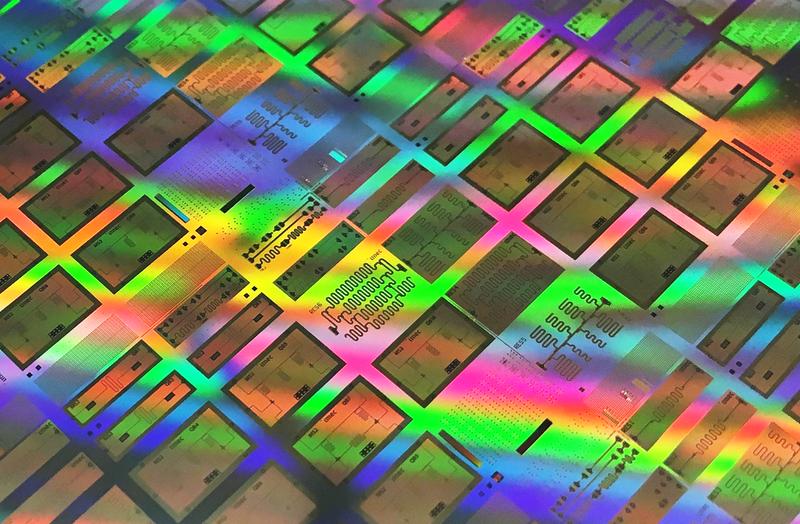 Test chip with superconducting qubits in a 300 mm integrated process prototype