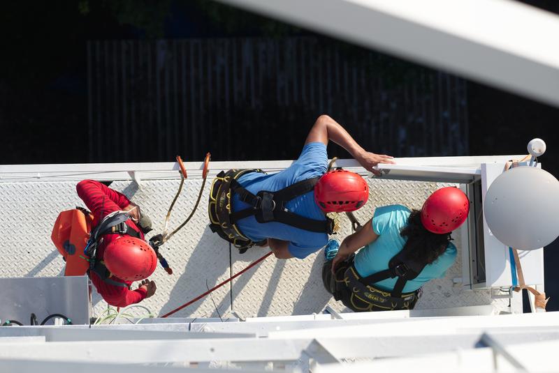 Scientists check a measuring device installed on one of the tower's lower platforms. 