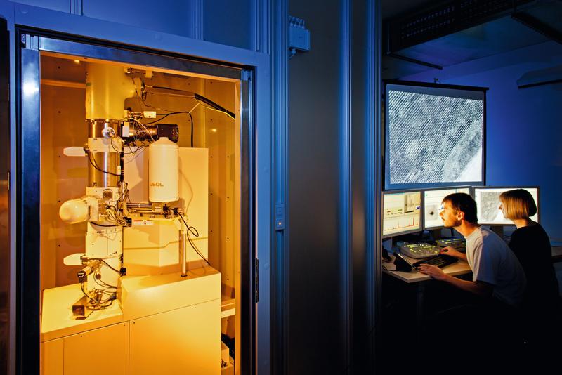 Researchers investigating a sample of the hard coating in the transmission electron microscope. 