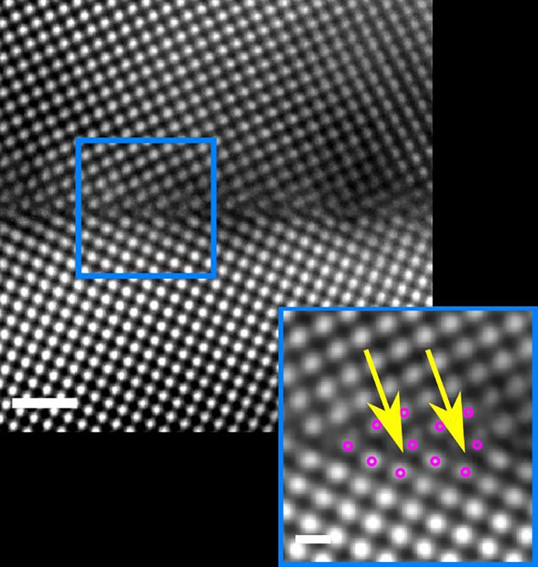 The image reveals a kite-type structural arrangement of the atoms at the ∑5 (310) [001] grain boundary.