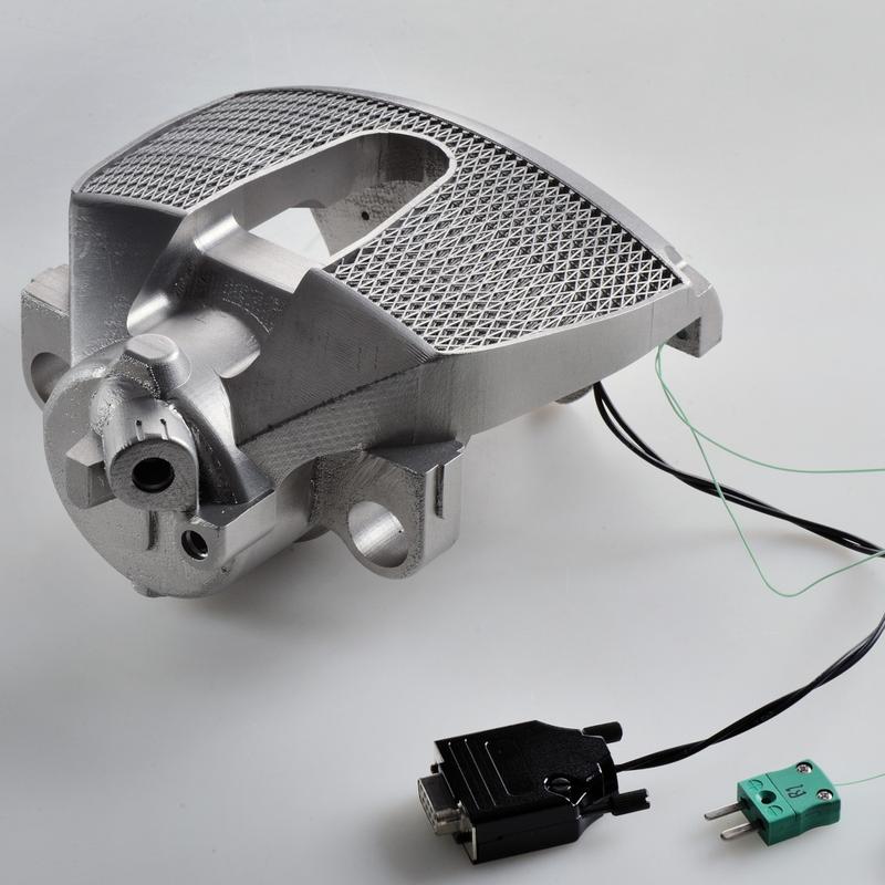 Mobility of the future: AM brake caliper with integrated sensors for measuring braking force and temperature.