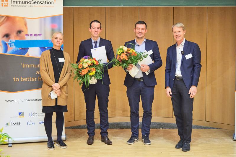 Prof. Dr. Dagmar Wachten (Vorstand der Bonner Universitätsstiftung), Prof. Dr. Sebastian Kobold, Prof. Dr. Tobias Bald und Prof. Dr. Gunther Hartmann (Prodekan für Forschung der Medizinischen Fakultät).