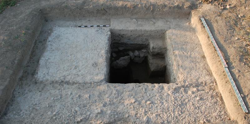 The excavation trench shows a pillar of the unfinished aqueduct.